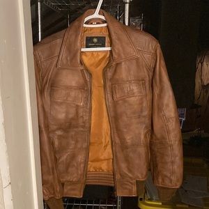 Men’s medium leather jacket. Form fitting.